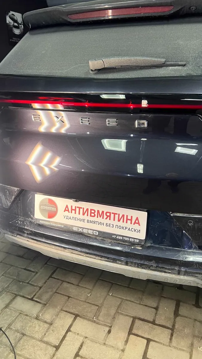 Крышка багажника после беспокрасочного удаления вмятины