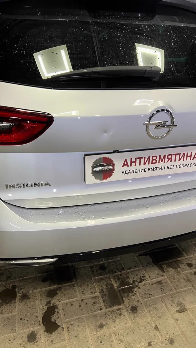 Вмятина на крышке багажника Opel Insignia — до ремонта